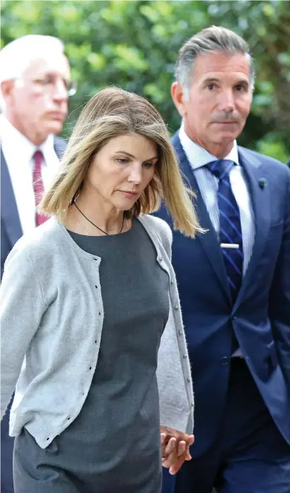  ?? STuART CAHILL / HeRALd sTAFF FILe ?? CASH FLOW PROBLEM: Actress Lori Loughlin and her husband Mossimo Giannulli have asked the court to reduce their bonds following their recent guilty pleas in the Varsity Blues college admissions scandal.