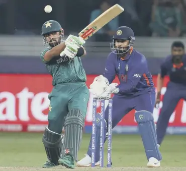  ?? ?? 0 Pakistan’s Babar Azam hits out watched by India wicket-keeper Rishabh Pant