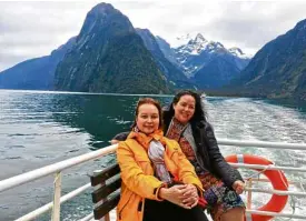  ??  ?? The author cruising in Milford Sound with friend Kathleen Liechtenst­ein