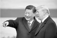  ??  ?? Photo shows China’s President Xi Jinping (left) and US President Trump at a welcome ceremony at the Great Hall of the People in Beijing last year.Trump accused China of seeking to influence knife-edge midterm congressio­nal elections by taking aim at his political base in the economic giants’ rapidly escalating trade war. — AFP photo