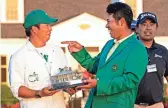  ??  ?? Hideki Matsuyama celebrates with his caddie Shota Hayafuj.