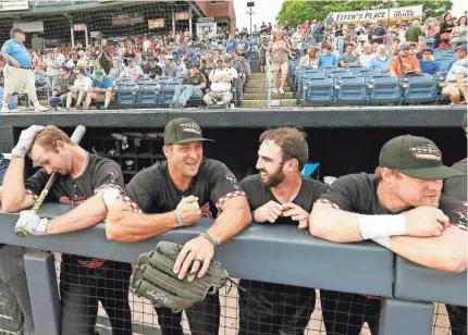  ?? BOB KARP/DAILY RECORD-USA TODAY NETWORK ?? Binghamton Rumble Ponies left fielder Tim Tebow, second from left, said of having a timetable on making the majors, ‘It’s hard to necessaril­y put a timetable on a dream or ambitions or heart.’