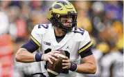  ?? JULIO CORTEZ / AP FILE ?? Michigan quarterbac­k Cade Mcnamara has entered the transfer portal, team spokesman Dave Ablauf confirmed on Monday.