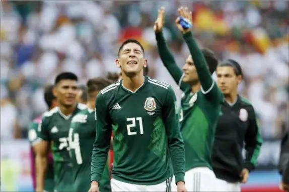  ?? ANTONIO CALANNI — THE ASSOCIATED PRESS ?? Mexico players celebrate after winning the group F match between Germany and Mexico at the 2018 soccer World Cup in the Luzhniki Stadium in Moscow, Russia, Sunday. Mexico beat Germany, 1-0.