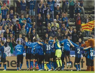  ??  ?? BRUGES PLAYERS celebrate victory over FC Zestafoni during their 2011 Europa league playoff soccer match in Bruges.