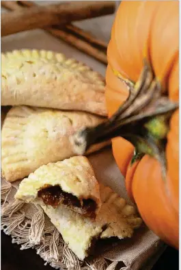  ?? JEANINE THURSTON ?? Pumpkin Empanadas from Yvette Marquez-Sharpnack’s cookbook, “Muy Bueno” (Hippocrene Books, 2012). Her grandma made the pumpkin filling from leftover jack-o’-lanterns.