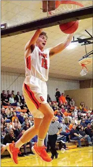  ?? WESTSIDE EAGLE OBSERVER/Randy Moll ?? Gravette’s Kelton Trembly breaks free for a slam dunk during nonconfere­nce play between Bentonvill­e and Gravette at the Lion Field House on Nov. 21.