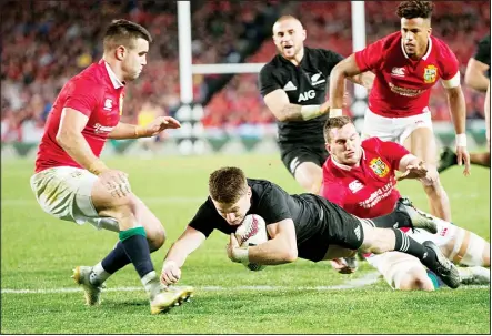  ??  ?? All Blacks’ Beauden Barrett is tackled by Sam Warburton and Conor Murray (left), during the first test between the British and Irish Lions and the All Blacks
at Eden Park in Auckland, New Zealand on June 24. (AP)