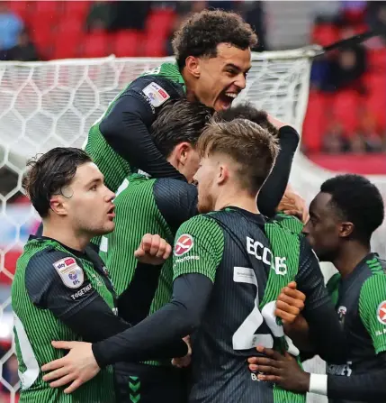  ?? ?? HAPPY DAYS: Coventry celebrate their winning goal against Stoke City in Saturday’s encounter.