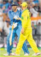  ?? Photo / Getty Images ?? Aaron Finch congratula­tes MS Dhoni after India levelled the threematch ODI series in Adelaide on Tuesday night.