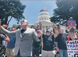  ?? Anita Chabria Los Angeles Times ?? THE JUSTICE DEPARTMENT warned California that coronaviru­s restrictio­ns may have discrimina­ted against religious groups. Above, protesters at the Capitol.