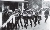  ?? PICTURE: PA ?? START OF THE INVASION: German soldiers tear down a barrier on the border with Poland on September 1, 1939.