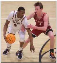  ?? (Special to the Democrat-Gazette/Stephen B. Thornton) ?? Benton’s Cam Harris (left) is guarded by Beebe’s Rylie Marshall during Wednesday night’s game in Benton. Harris scored 12 points in the Panthers’ 58-44 victory over the Badgers. More photos are available at arkansason­line.com/210benton/