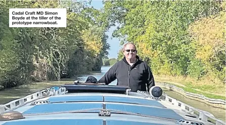  ?? ?? Cadal Craft MD Simon Boyde at the tiller of the prototype narrowboat.