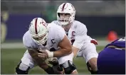  ?? ELAINE THOMPSON — THE ASSOCIATED PRESS, FILE ?? Stanford center Drew Dalman, left, snaps the ball to quarterbac­k Davis Mills during a game against Washington earlier this month.