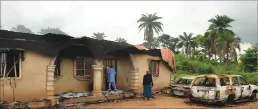  ??  ?? Some of the houses and vehicles burnt during the recent Ilofa Odo-Owa communal clashes in Oke-Ero Local Government Area of Kwara State.