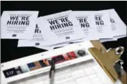  ?? AP FILE ?? Job applicatio­ns and informatio­n for the Gap Factory Store sit on a table during a job fair at Dolphin Mall in Miami.