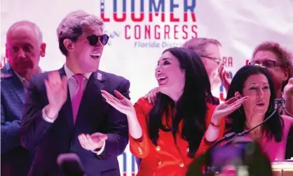  ??  ?? Laura Loomer celebrates with Milo Yiannopoul­os, and campaign director Karen Giorno, at an election night event in West Palm Beach, Florida on 18 August 2020. Photograph: Allen Eyestone/AP