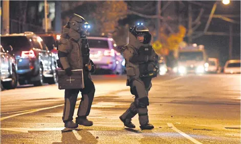  ?? EPA ?? Bomb squad police enter the Buckingham Serviced Apartments in Brighton in Melbourne, Australia, on Monday. Police were responding to reports of an explosion.