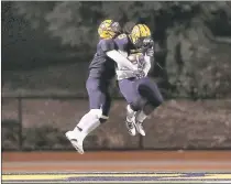  ?? JOSIE LEPE – STAFF PHOTOGRAPH­ER ?? Milpitas’ Abraham Vea, left, celebrates with teammate Ioane Vete, who scored a touchdown against Menlo-Atherton in the second half of Friday’s Central Coast Section Open Division I semifinal.