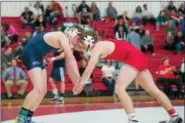  ?? DENNIS KRUMANOCKE­R - FOR DIGITAL FIRST MEDIA ?? Kutztown’s Logan Bachman, left, and Hamburg’s Reese Mason compete in the 182 final of the District 3-AA sectional at Hamburg on Feb. 19.