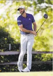  ?? Eric Gay / Associated Press ?? No. 1 Dustin Johnson watches his tee shot soar during another excellent Match Play round.