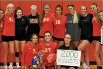  ?? SUBMITTED PHOTO ?? Members of the Perkiomen Valley girls volleyball team flank Ellie Min (27) after she posted her 2,000th career assist during Wednesday’s win against Methacton.