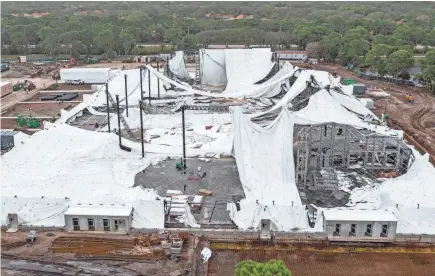  ?? GREG LOVETT/THE PALM BEACH POST ?? The air-supported dome for the future home of the TGL indoor golf league that was founded by Tiger Woods and Rory McIlroy was damaged and deflated Tuesday night after a temporary power system outage at the site. There were no injuries, and no technology was damaged in Palm Beach Gardens, Florida.