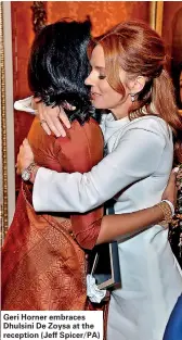  ??  ?? Geri Horner embraces Dhulsini De Zoysa at the reception (Jeff Spicer/PA)