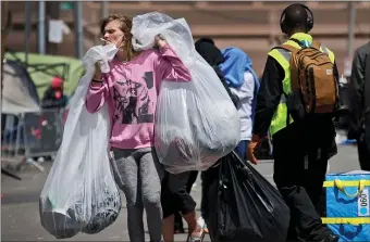  ?? NANCY LANE/BOSTON HERALD ?? The city also rolled out a “Friends and Family” reunificat­ion program in an attempt to help those in need seek support from people in their lives.