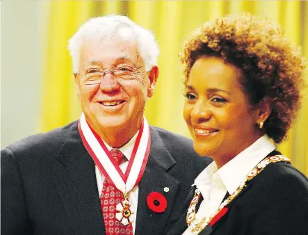  ?? PAT MCGRATH ?? Clayton Riddell is honoured as an Officer of the Order of Canada by then-governor general Michaelle Jean in 2008. Riddell, called a “titan of our community” by Mayor Naheed Nenshi, died Saturday at age 81. “Calgarians feel his legacy now, and we will feel it for many years to come,” Nenshi said.