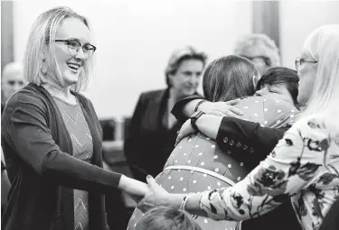  ?? Photos by Melissa Phillip / Staff photograph­er ?? Cassidy Stay, left, smiles with family members after Ronald Haskell, who was convicted of killing six of her family members execution-style in 2014, was sentenced to the death penalty on Thursday.