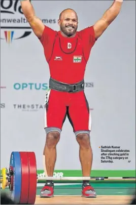  ?? AP ?? ■ Sathish Kumar Sivalingam celebrates after clinching gold in the 77kg category on Saturday.