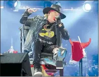  ?? Democrat-Gazette file photo ?? Axl Rose, recuperati­ng from a broken foot, performs at a 2016 concert by AC/DC.