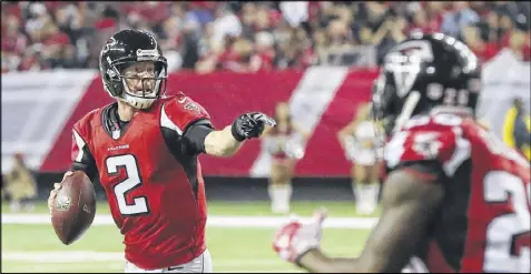  ?? CURTIS COMPTON /CCOMPTON@AJC.COM ?? Falcons quarterbac­k Matt Ryan directed the offense to touchdowns on all five of its possession­s in the first half of Sunday’s 38-32 victory over the Saints in the regular-season finale.