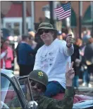  ??  ?? Ryan Berkey and veteran Steve Roy take part in the parade with the Lansdowne American Legion.