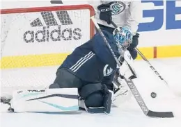  ?? TED S. WARREN/AP ?? Goaltender Philipp Grubauer, who spent the last three seasons with the Avalanche, and the expansion Kraken will open their first training camp Thursday in Seattle.