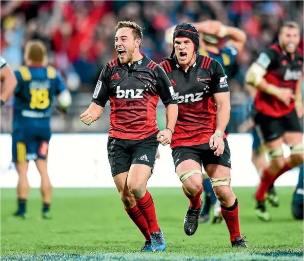  ??  ?? Mitch Hunt celebrates his match-winning drop goal, along with Matt Todd, in Christchur­ch yesterday.