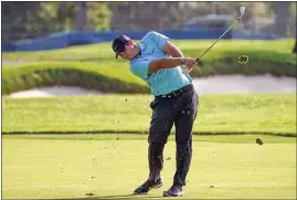  ?? JOHN MINCHILLO / AP ?? Patrick Reed plays a shot off the second fairway during the second round of the U.S. Open Golf Championsh­ip on Friday in Mamaroneck, N.Y.