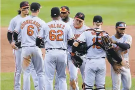  ?? JEFFREY T. BARNES/AP ?? The Orioles celebrate a 7-5 victory over the Blue Jays during Sunday’s season finale in Buffalo, N.Y.