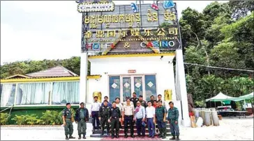  ?? SUPPLIED ?? Deputy provincial governor Mang Sineth headed a team of specialise­d officers and other authoritie­s to visit Jinding Hotel and Casino on Friday and order the casino to cease operating.