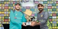  ?? Supplied photo ?? Australian skipper Finch and Pakistan captain Ahmed with the series trophy at the press briefing. —