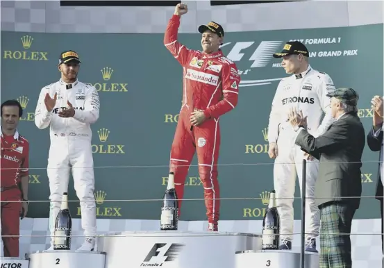  ??  ?? 2 A tartan-clad Sir Jackie Stewart applauds as Sebastian Vettel (first), Lewis Hamilton (second) and Valtteri Bottas (third) take to the poduium. Hamilton led in Melbourne early on, below, but had to settle for a runners-up spot in the opening race of...