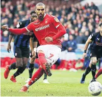  ??  ?? LEW BEAUTY Lewis Grabban scores from the penalty spot