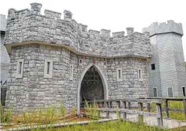  ?? STAFF FILE PHOTOS BY ERIN O. SMITH ?? A moat and bridge are at the entrance of the partially built Werner castle Wednesday in Cloudland, Georgia.