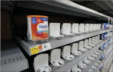  ?? ERIC GAY — THE ASSOCIATED PRESS ?? Shelves typically stocked with baby formula sit mostly empty. Parents across the U.S. are scrambling to find baby formula because supply disruption­s and a massive safety recall have swept many leading brands off store shelves.