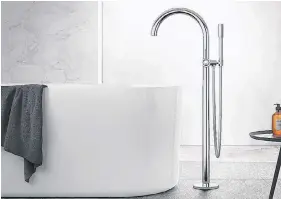  ?? POSTMEDIA ?? The elegant symmetry of Grohe’s Atria tub filler gives it design staying power.