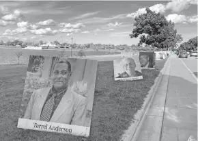  ?? [ED WHITE/ASSOCIATED PRESS] ?? Hundreds of photos of Detroit residents who have died of COVID-19 have been contribute­d by families for display at Belle Isle State Park in Detroit.