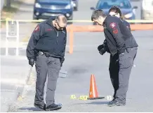  ?? DARREN MAKOWICHUK ?? City police investigat­e a fatal shooting on f Bowness Rd. N.W. early Saturday that claimed the life of a man in his 40s.