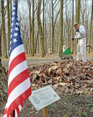  ?? DFM FILE PHOTO ?? Approximat­ely 60 volunteers showed up to the Friends of the Medal of Honor Grove spring cleanup on Sunday, April 13, 2014. The volunteers picked up leaves and sticks, as well as used a chipper and chain saws to remove larger debris from the site at the...